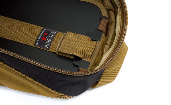 A close shot of the removeable frame sheet of the Guide's Edition Synapse 25 attached to the rail loops of the main compartment.